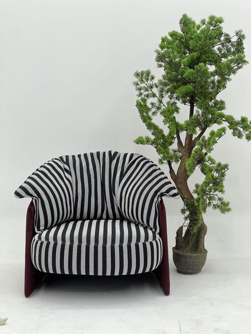 Striped Upholstered Lounge Chair with Sculpted Backrest for Interior Projects