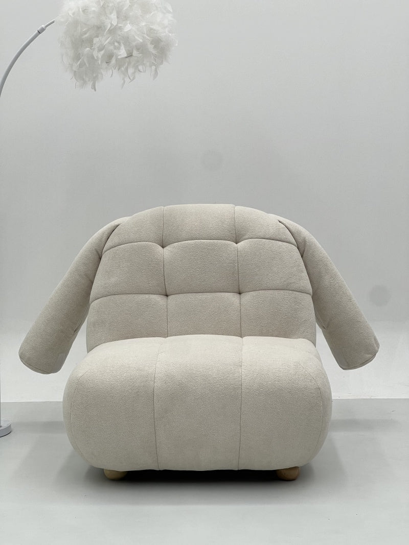 Upholstered Lounge Chair with Quilted Cushioning and Soft Armrest Design