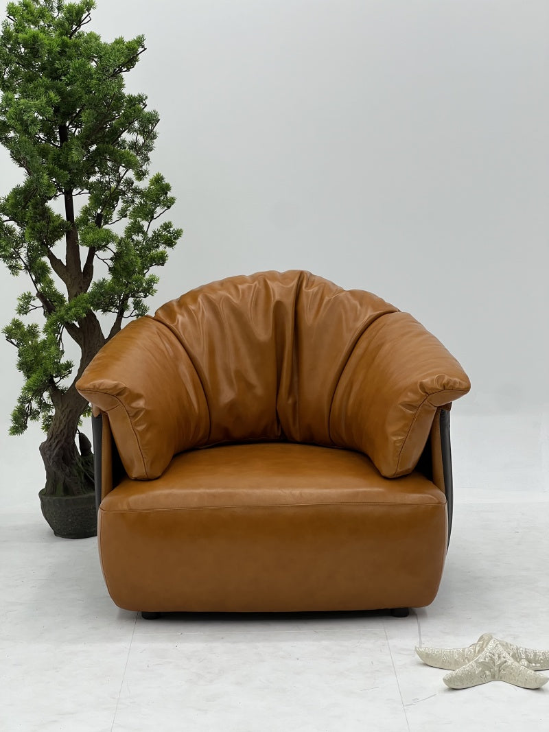 Brown Leather Lounge Chair with Sculpted Backrest and Deep Seat