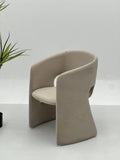 Curved Upholstered Lounge Chair with Enclosed Back Design