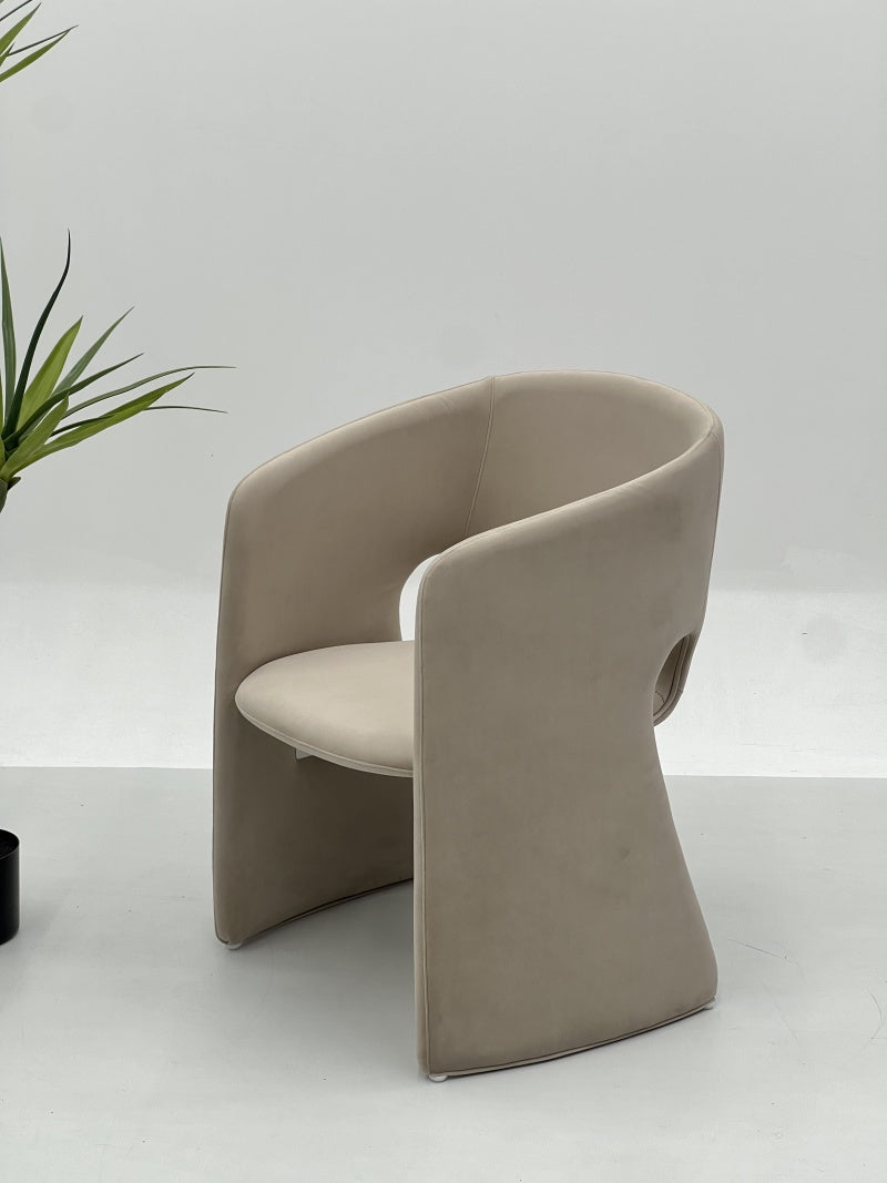Curved Upholstered Lounge Chair with Enclosed Back Design