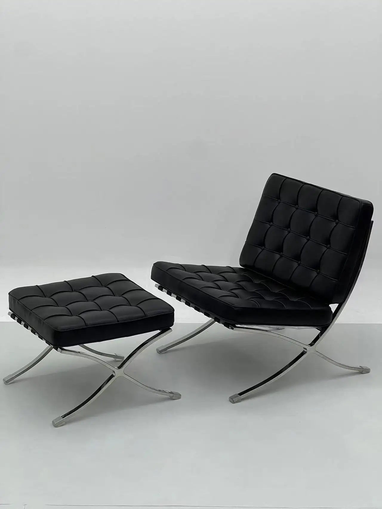 Black Tufted Lounge Chair with Chrome Frame & Ottoman ¨C Iconic Modern Accent Seating for Boutique Hotels & Commercial Spaces