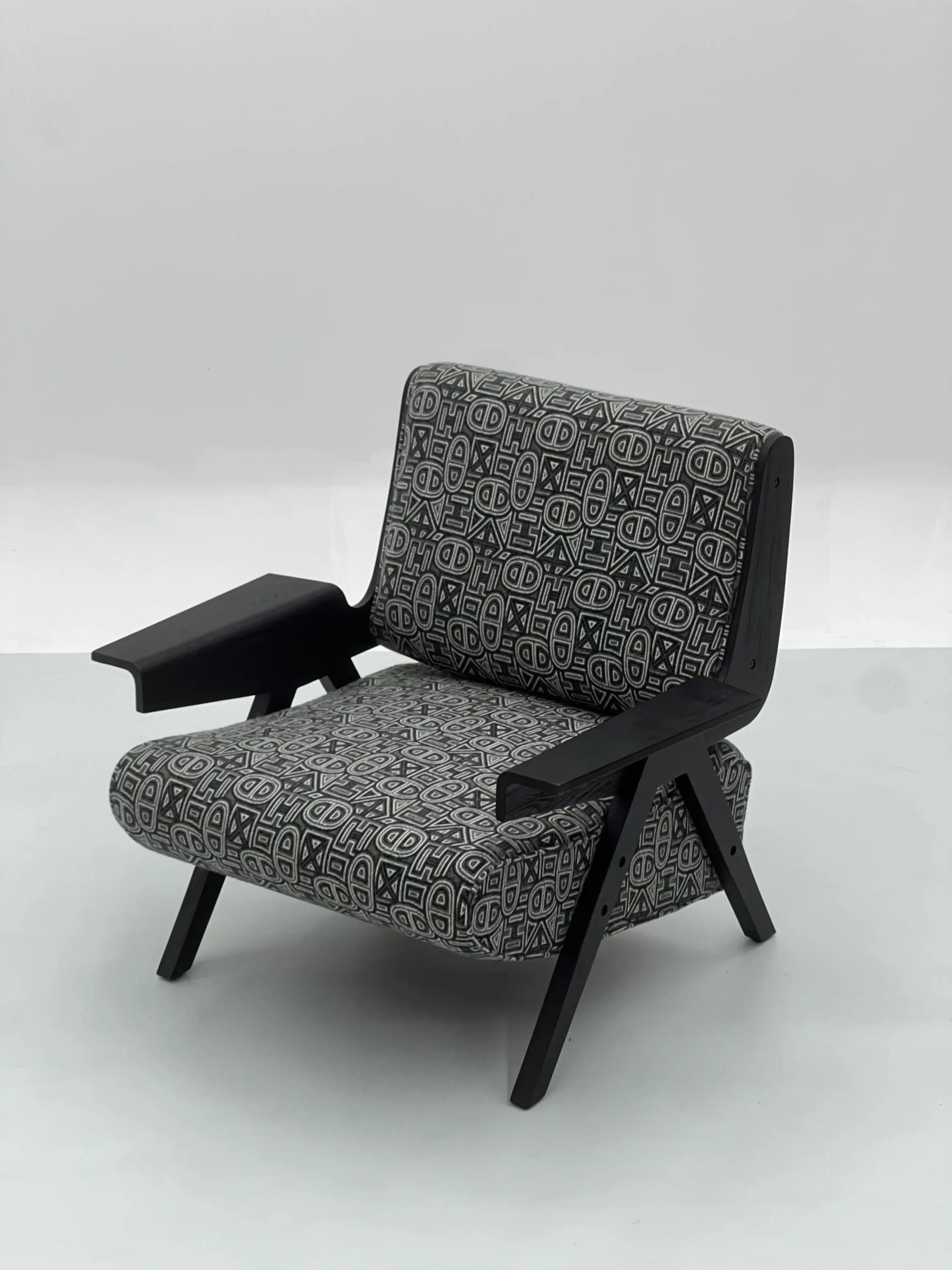 Black White Geometric Lounge Chair with Black Frame ¨C Modern Artistic Accent Seating for Boutique Hotels & Commercial Spaces