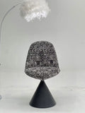 Black White Speckled Swivel Chair with Black Cone Base ¨C Artistic Modern Accent Seating for Boutique Hotels & Commercial Lounges