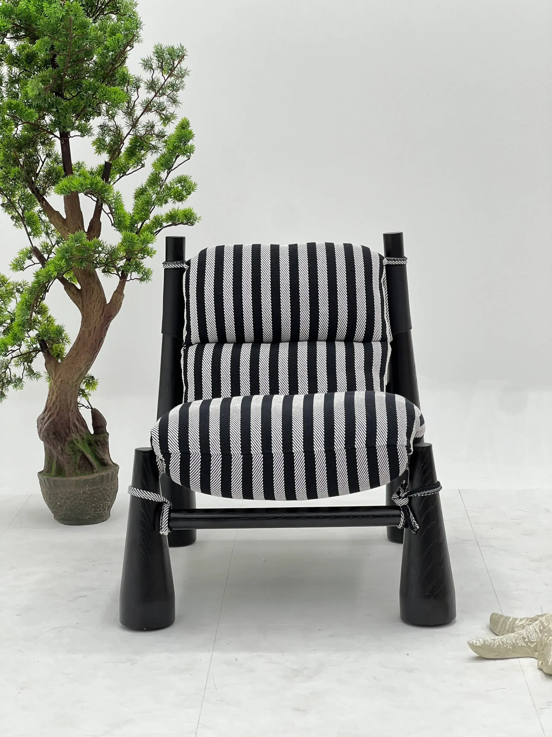 Black White Striped Lounge Chair with Rope Detail & Black Frame ¨C Artistic Modern Accent Seating for Boutique Hotels & Commercial Spaces