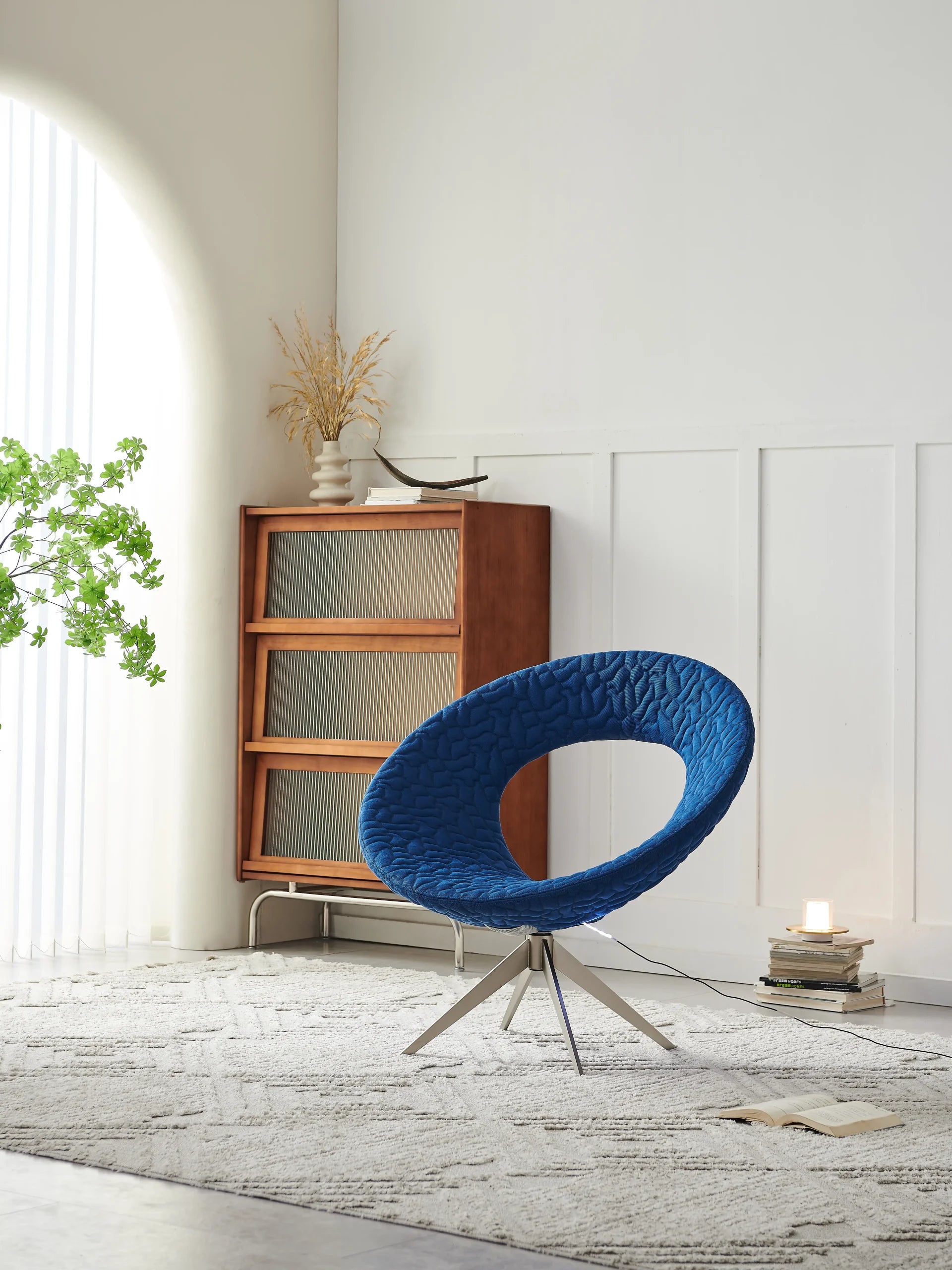 Blue Quilted Orbit Lounge Chair with Chrome Swivel Base ¨C Modern Sculptural Accent Seating for Boutique Hotels & Commercial Lounges
