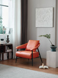 Burnt Orange Leather Lounge Chair with Black Frame ¨C Luxurious Modern Accent Seating for Boutique Hotels & Commercial Spaces