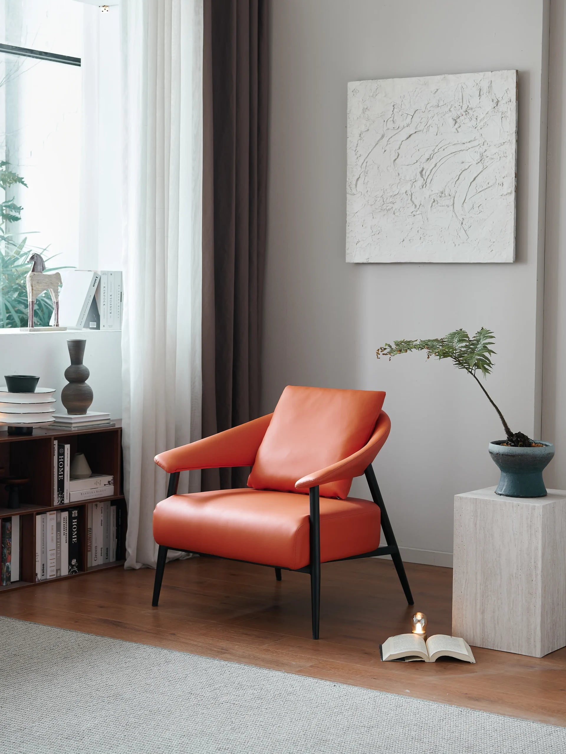 Burnt Orange Leather Lounge Chair with Black Frame ¨C Luxurious Modern Accent Seating for Boutique Hotels & Commercial Spaces