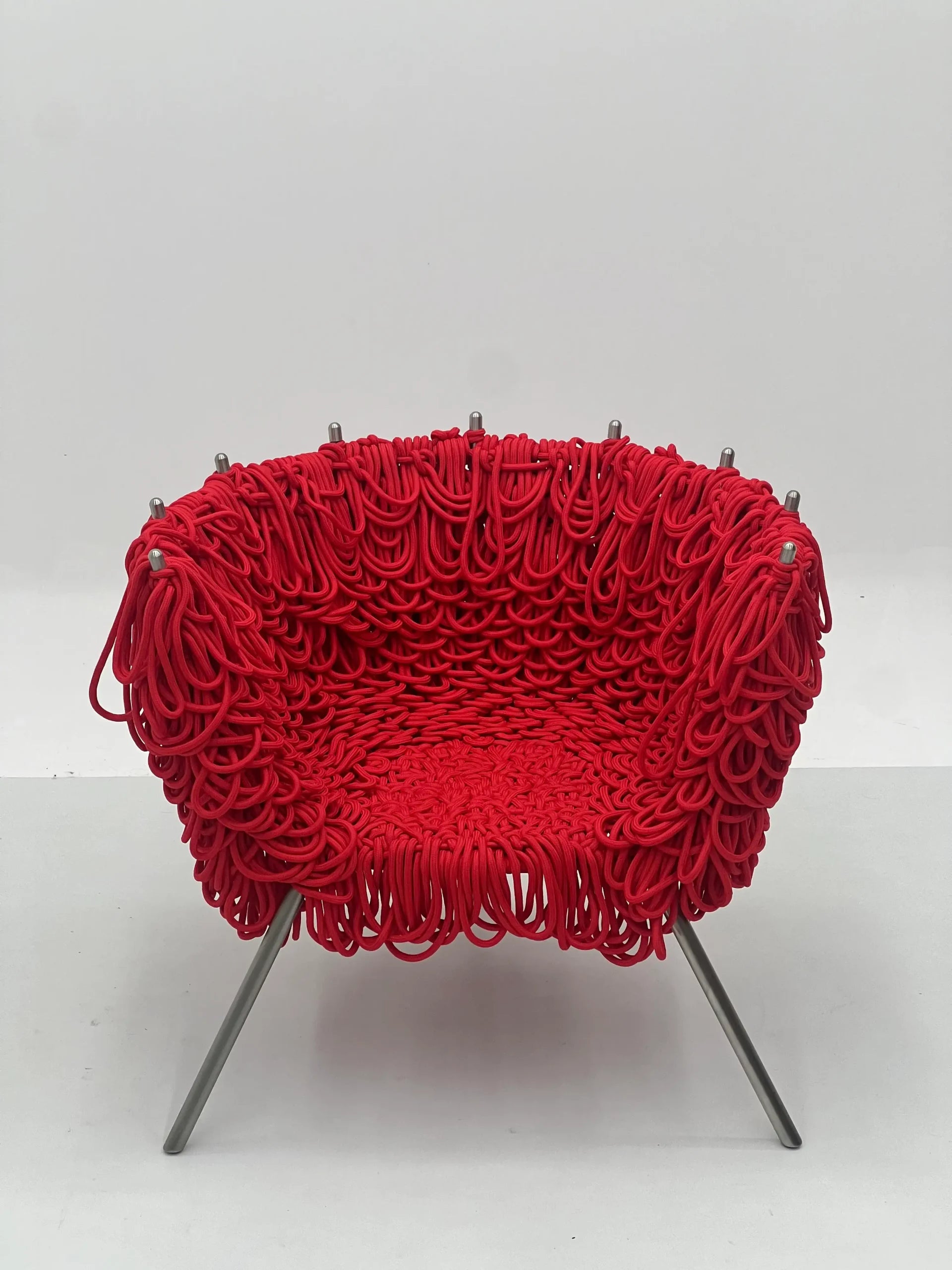 Red Rope Woven Lounge Chair with Silver Legs ¨C Artistic Modern Accent Seating for Boutique Hotels & Commercial Spaces