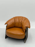 Tan Leather Cloud Lounge Chair with Striped Base ¨C Sculptural Luxury Accent Seating for Boutique Hotels & Commercial Spaces