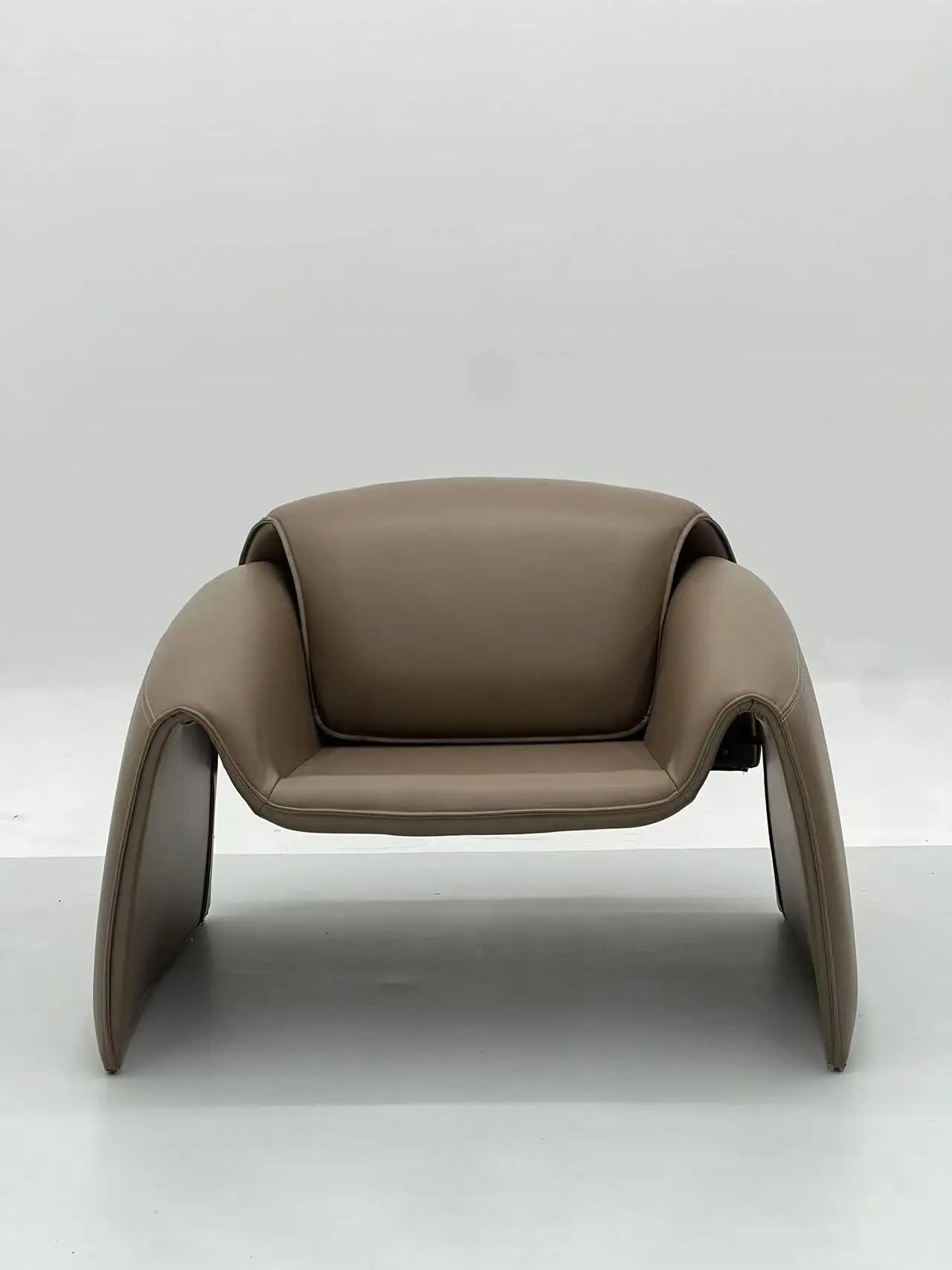 Taupe Leather Lounge Chair with Sculptural Base ¨C Luxurious Modern Accent Seating for Boutique Hotels & Commercial Spaces