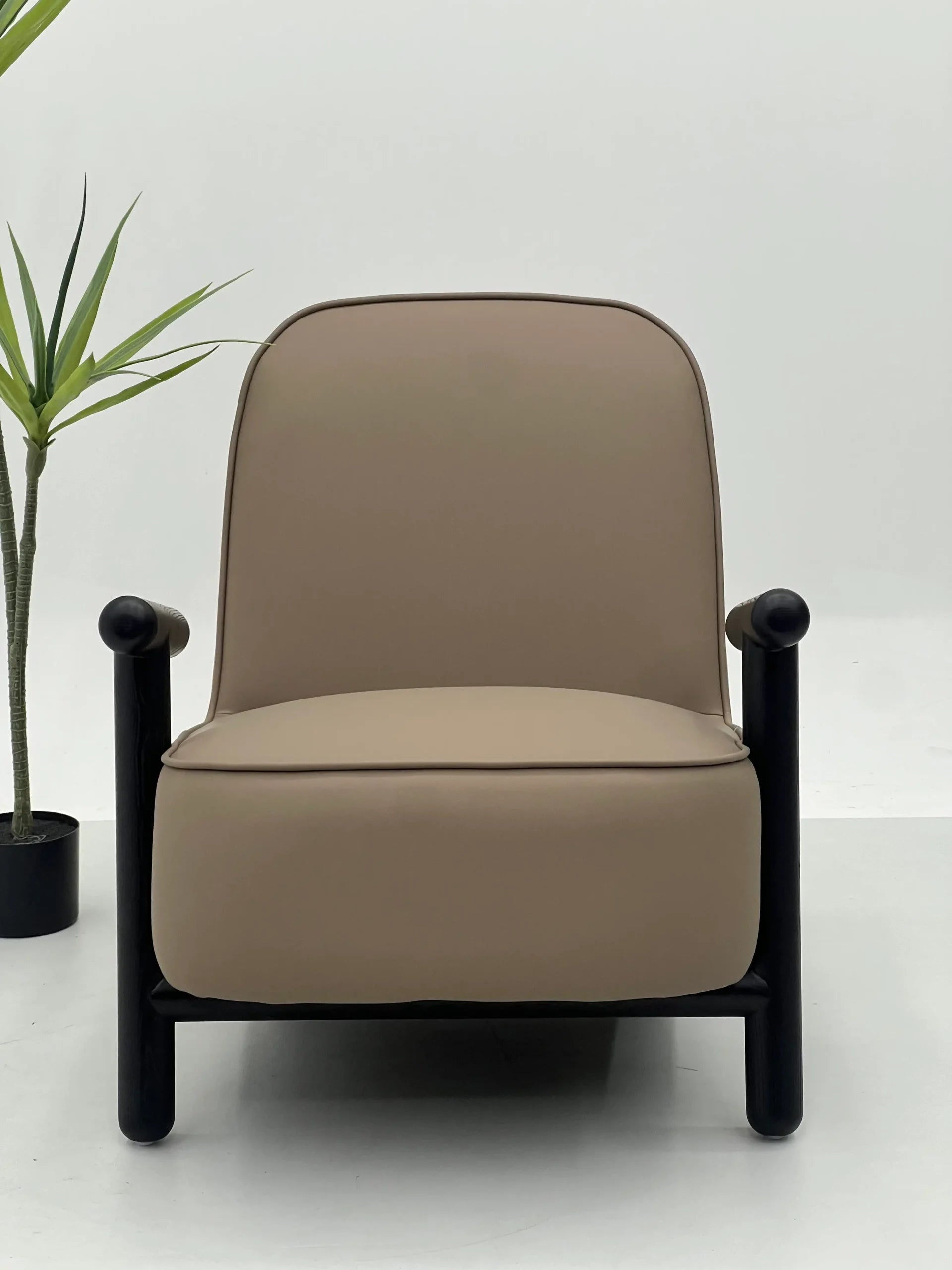 Modern Taupe Lounge Chair with Black Sculptural Arms ¨C Premium Relaxed Seating for Commercial Hotels, Offices & Executive Lounges