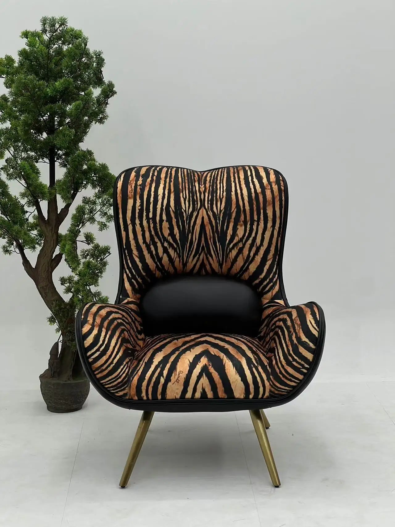 Tiger Print Lounge Chair with Gold Legs ¨C Bold Luxurious Accent Seating for Boutique Hotels & Commercial Spaces